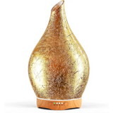 Gold teardrop-shaped oil diffuser with wooden base in Elegant 3D Glass Marble design