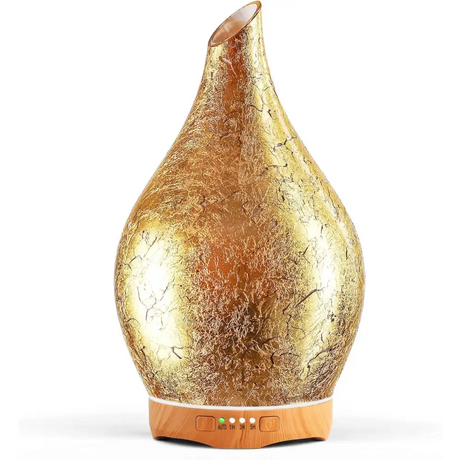 Gold teardrop-shaped oil diffuser with wooden base in Elegant 3D Glass Marble design