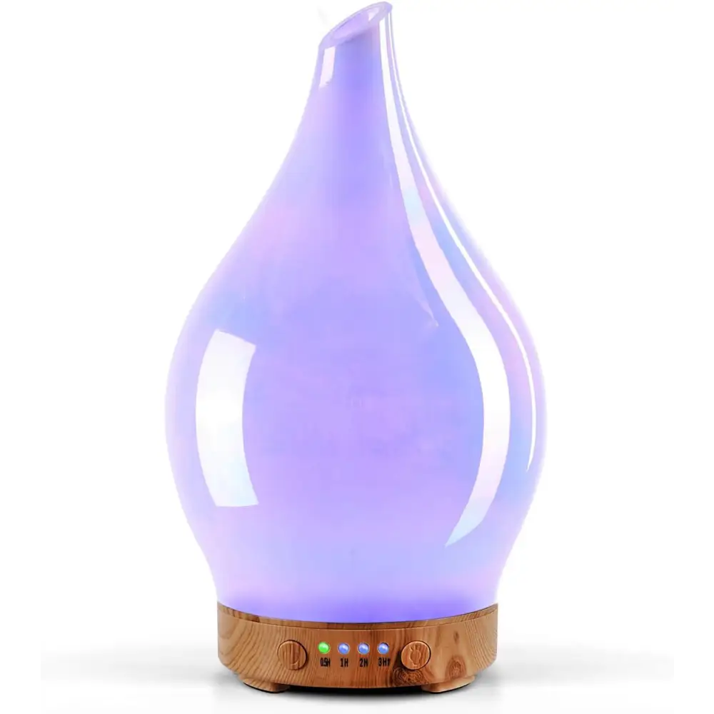 Teardrop-shaped purple glass aromatherapy oil diffuser with wooden base and LED lights