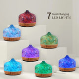 Color-changing LED diffusers with glass dome and wood base in Elegant Glass Essential Oil Diffuser