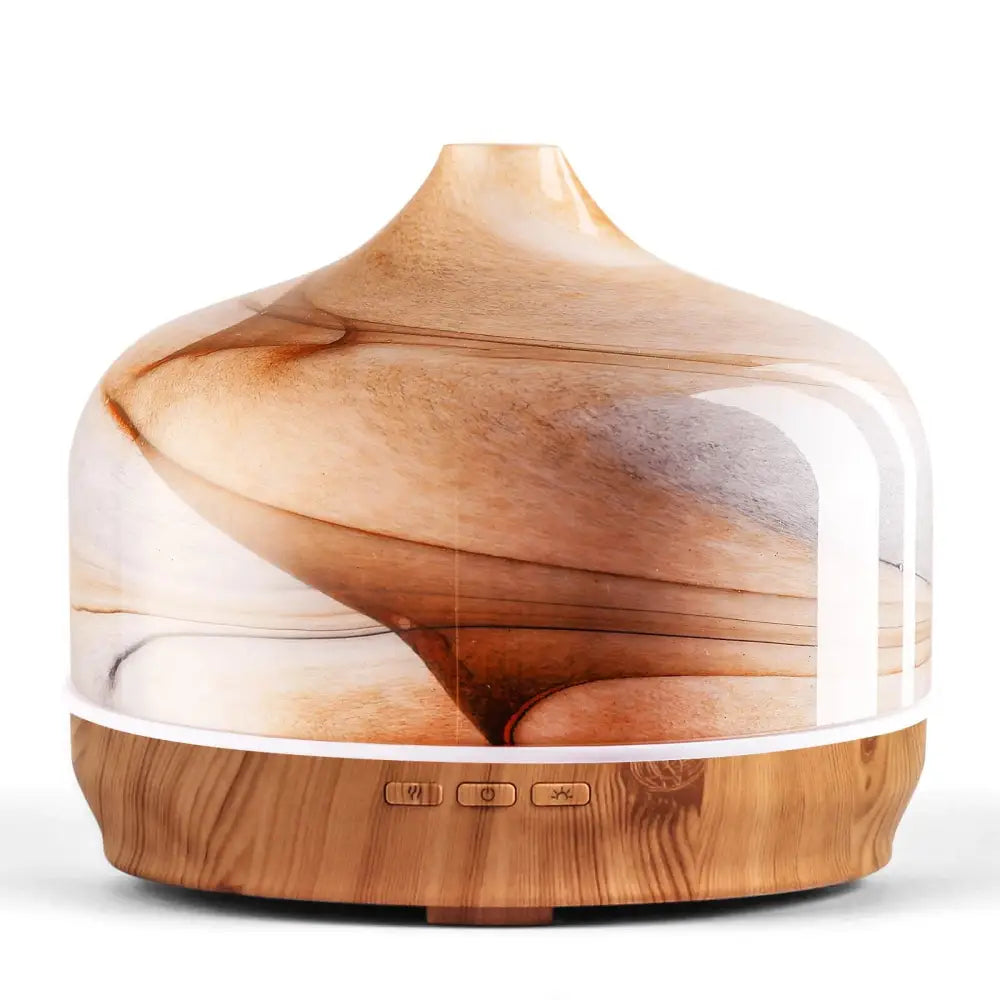 Elegant glass essential oil diffuser with wood base and swirling brown patterns