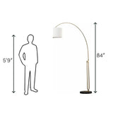 Elegant Joan Arched Floor Lamp featuring curved brass design, white shade, and marble base