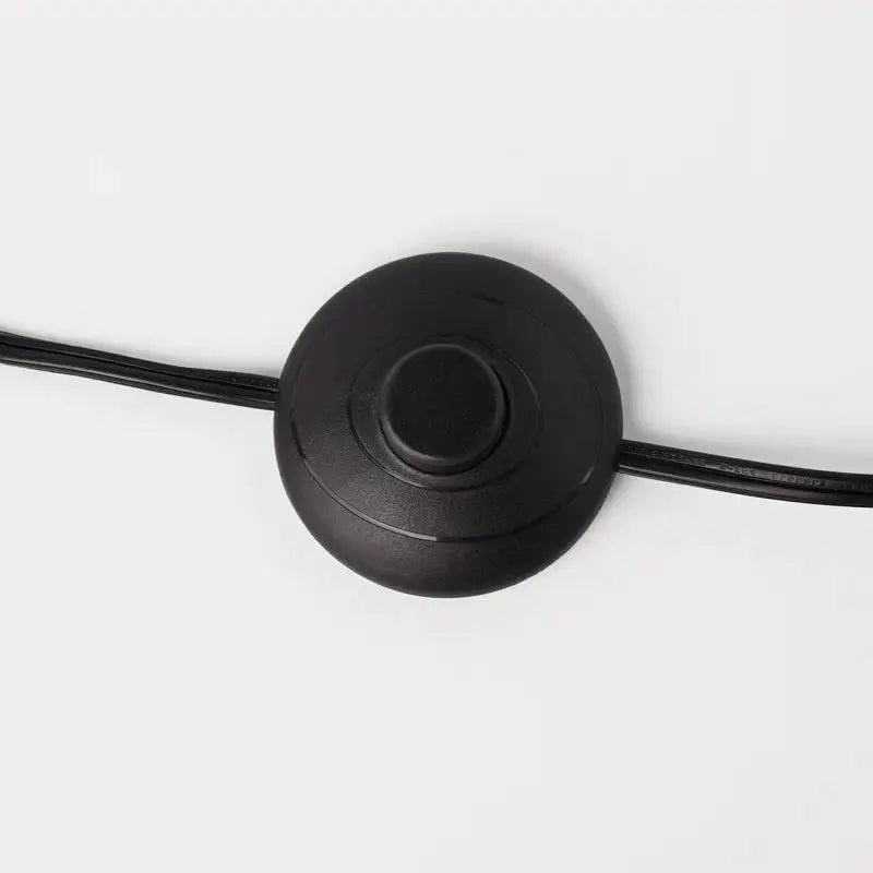 Black circular floor switch with cord for Elegant Joan Arched Floor Lamp