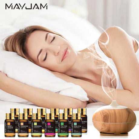 Essential Oils Gift Set with 20 bottles, diffuser, and person peacefully sleeping