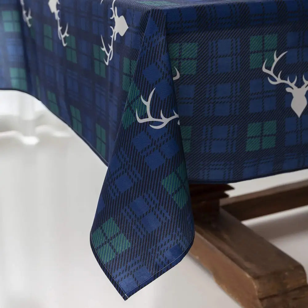 Plaid Christmas tablecloth with navy blue and green deer head silhouettes design