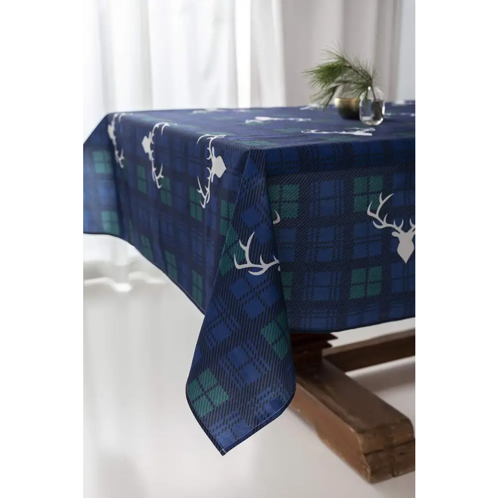 Navy and green plaid Christmas tablecloth with white deer head silhouettes