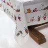 White Christmas tablecloth with festive deer and plaid border for holiday gatherings