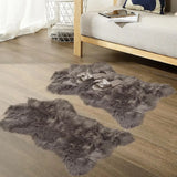 Gray fluffy long pile faux sheepskin fur area rugs arranged on a cozy floor