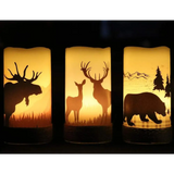 Three flameless flickering candles with woodland animal silhouettes and hemp rope accents