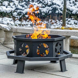 Black metal Geometric Wood Burning Fire Pit with star cutouts and flames for camping trips