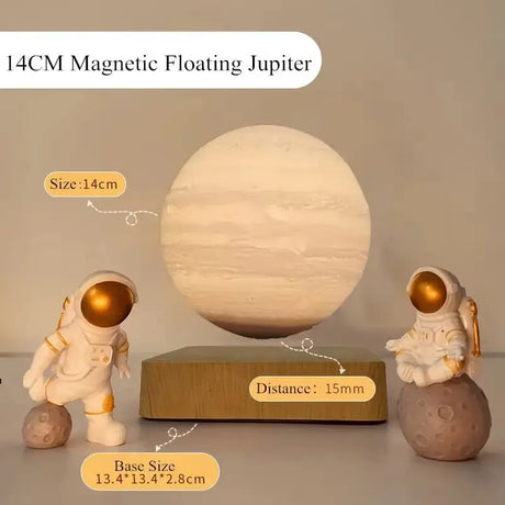 Magnetic floating model of Jupiter as a glowing night light with astronaut figurines