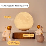 Magnetic floating moon lamp above wooden base with astronaut figurines as night light