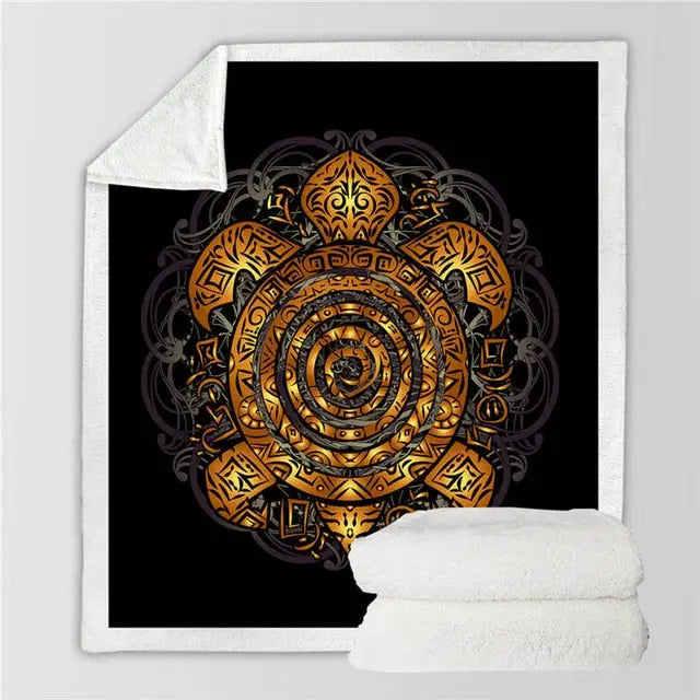 Intricate golden spiral mandala on a black surface of a soft fleece blanket