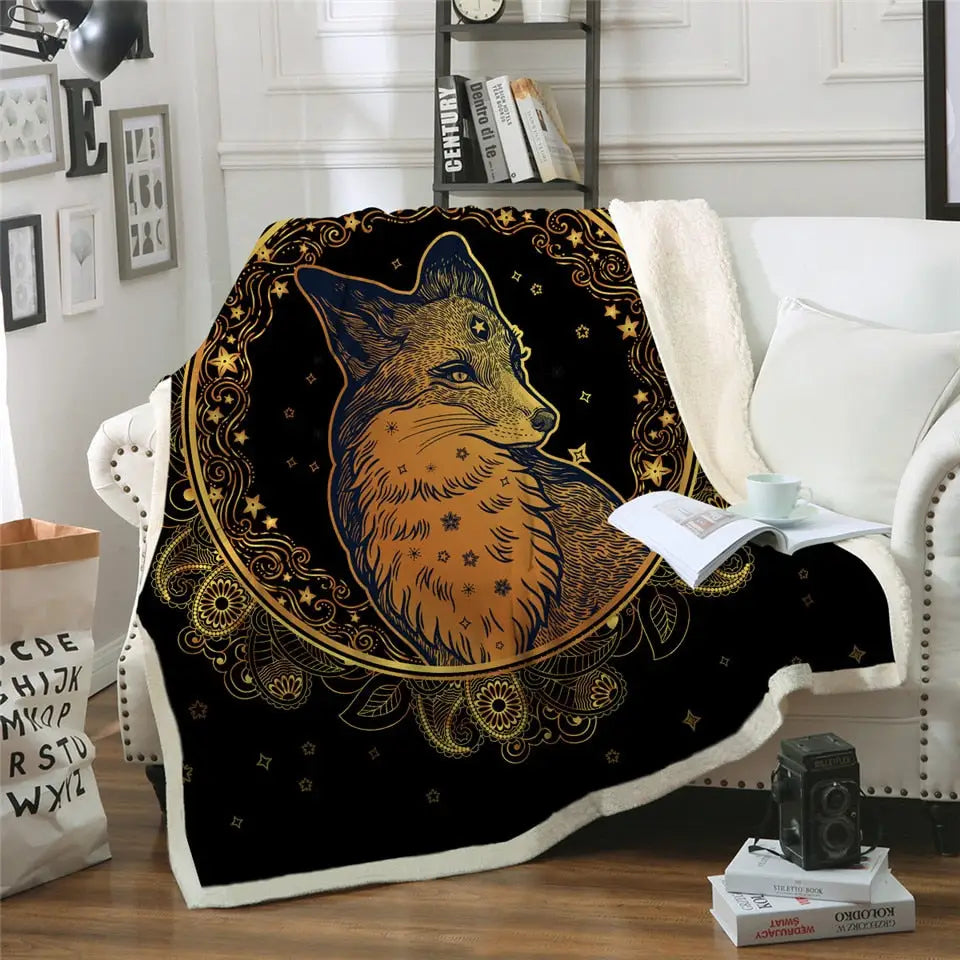 Fluffy fleece blanket with mystical fox design and golden celestial patterns on black background