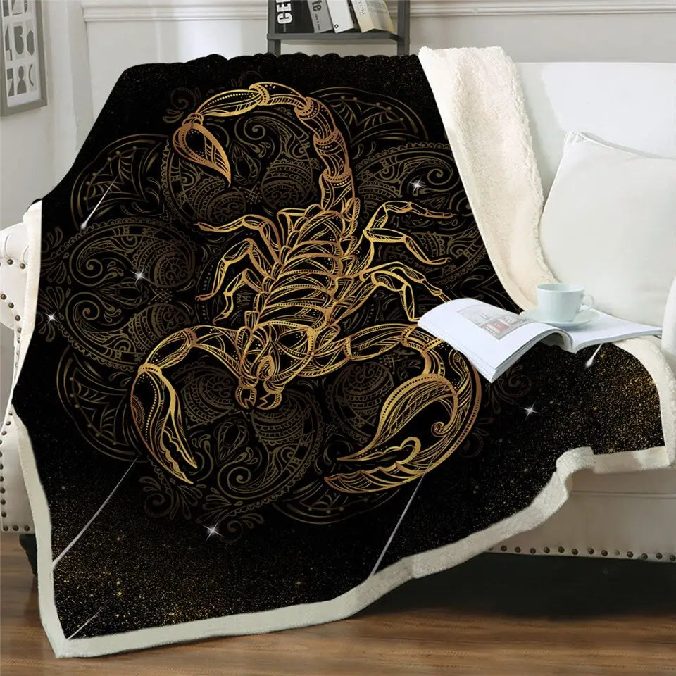 Golden scorpion design on a black sherpa fluffy fleece blanket with ornate patterns