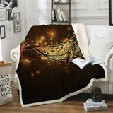 Golden Whale fleece blanket against a cosmic backdrop with sparkles, perfect soft decor