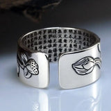 Silver cuff bracelet with engraved Chinese characters and decorative designs in sterling silver