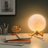 Glowing GoodNight Moon Lamp Night Light on a wooden stand for soothing ambiance