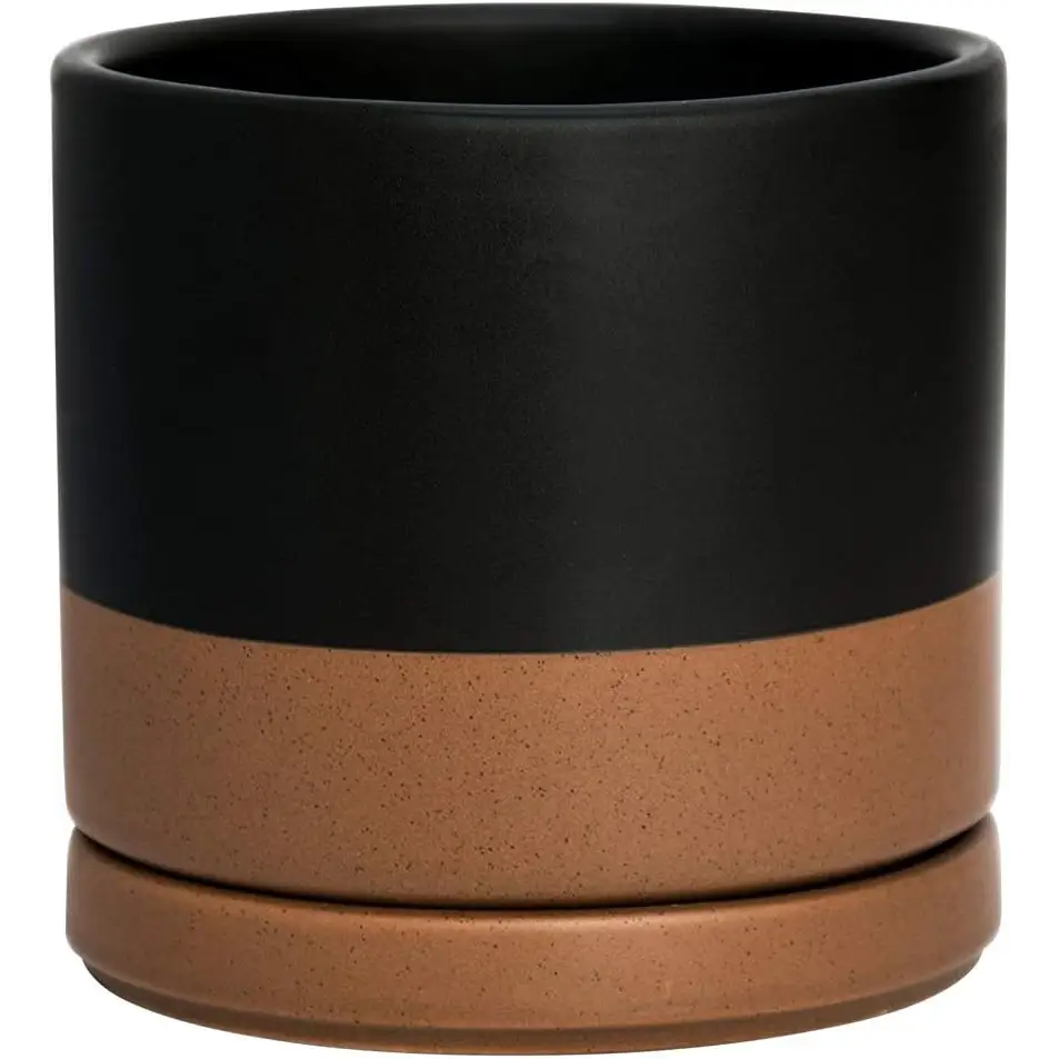 Two-toned ceramic planter pot with drainage hole featuring a matte black top and terracotta bottom