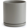 Simple gray ceramic planter pot with drainage hole and attached saucer for Green Fern