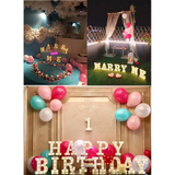 Collage of illuminated marquee letters and balloons for Happy Birthday celebrations