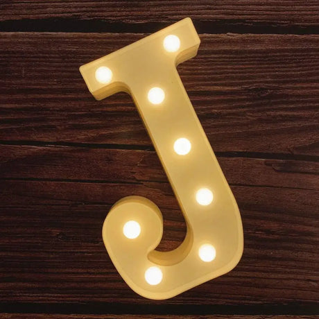 Illuminated letter J with glowing LED bulbs in Illuminated Marquee Letters sign