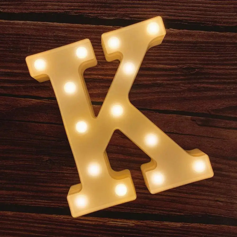 Illuminated marquee letter K with glowing bulbs for Happy Birthday Sign decor