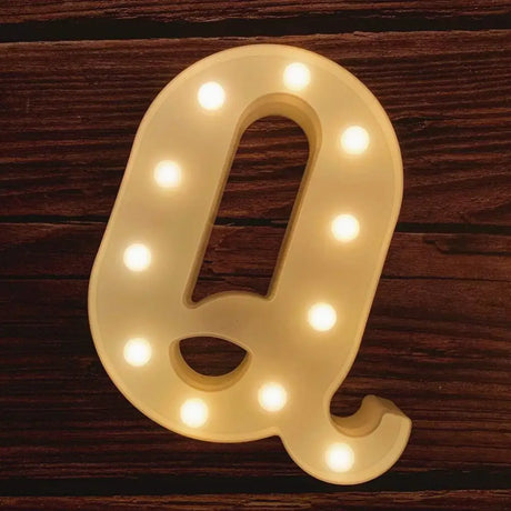 Illuminated letter Q with glowing light bulbs for illuminated marquee letters sign