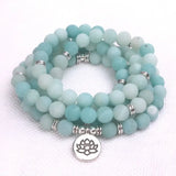 Beaded wrap bracelet with frosted aqua stones and silver lotus charm, spiritual jewelry