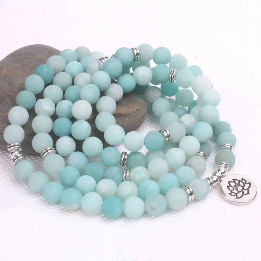 Beaded necklace with frosted blue Amazonite stones and lotus charm for spiritual jewelry