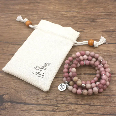 Pink Mala Beads Bracelet with Lotus Charm and White Drawstring Pouch for Spiritual Jewelry