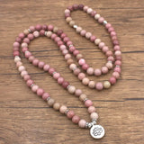 Pink Rhodonite beads bracelet with a lotus charm pendant for spiritual practices