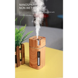 Wooden oil diffuser emitting mist with LED night light for aromatherapy relaxation