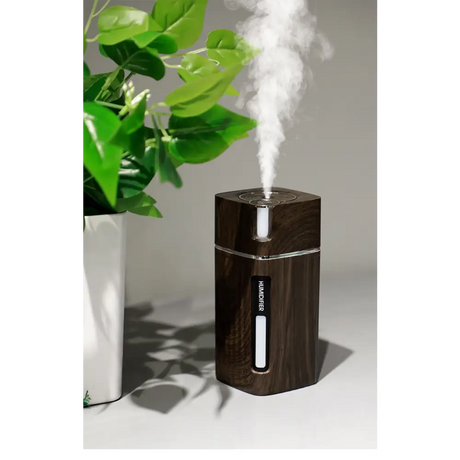 Dark wooden essential oil diffuser with mist and LED night light feature