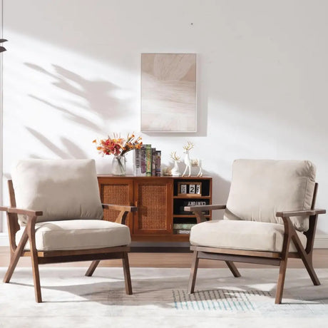 Two mid-century modern accent chairs with removable cushions and wooden frames