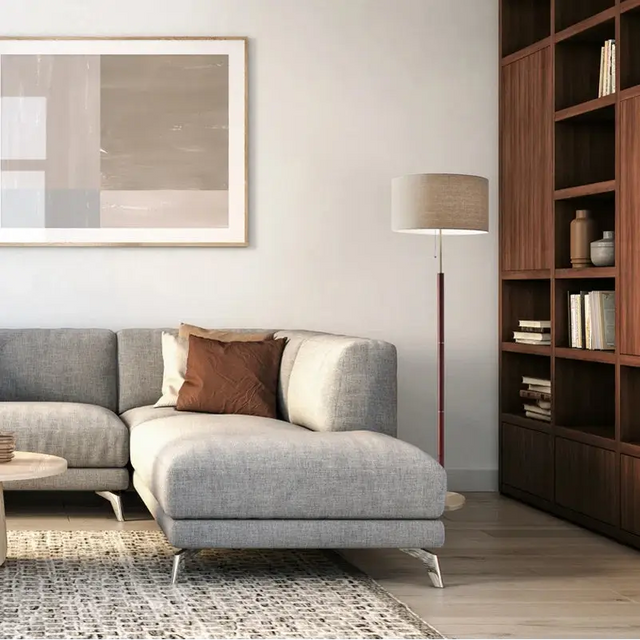 Modern Grey Sectional Sofa with Brown Accent Pillow and Elegant Fernando Floor Lamp