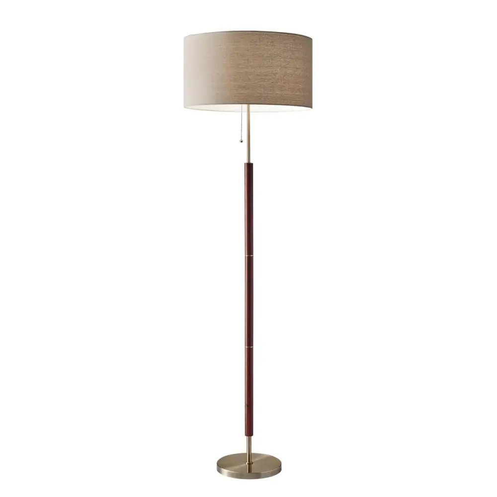 Modern floor lamp with wooden pole and beige shade next to Modern Grey Sectional Sofa