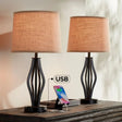 Two modern industrial table lamps in dark iron with beige shades and USB ports