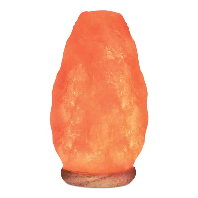 Glowing Pink Himalayan crystal salt lamp on wooden base for natural ambiance