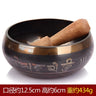 Tibetan singing bowl with wooden striker and carved Sanskrit symbols, Himalayan hand-hammered