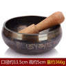 Tibetan singing bowl with striker showcasing carved Sanskrit symbols, Himalayan hand-hammered