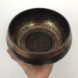 Decorative bronze Nepal Tibetan singing bowl with intricate etched patterns