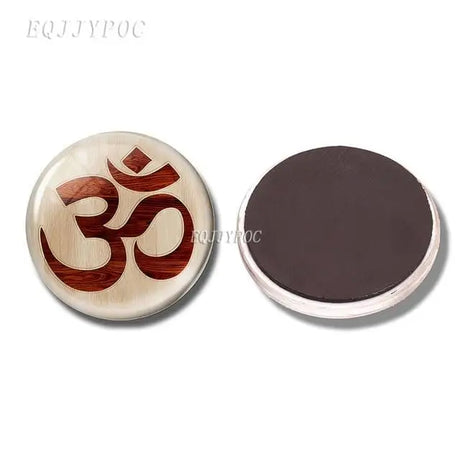 Circular magnet with brown Om symbol on cream surface, perfect for boho refrigerator decor