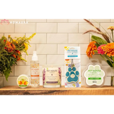 Pet care products and Eco-Friendly Soy Candles for odor control on a wooden shelf