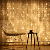 Modern wire mesh chair with plush seat under Romantic Curtain String Lights backdrop