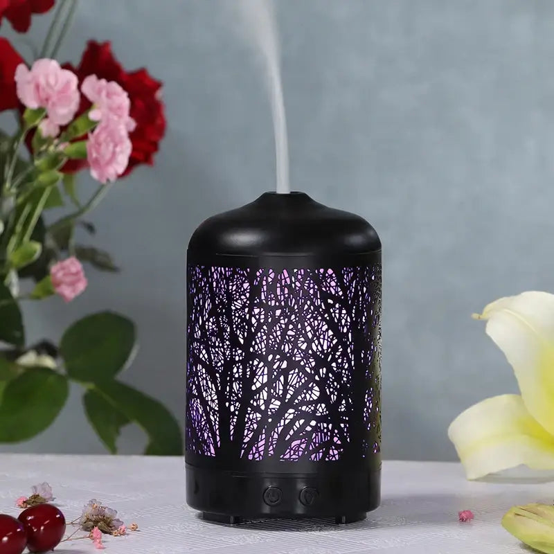 Black Sacred Tree Essential Oil Diffuser illuminated in purple for ultrasonic aromatherapy