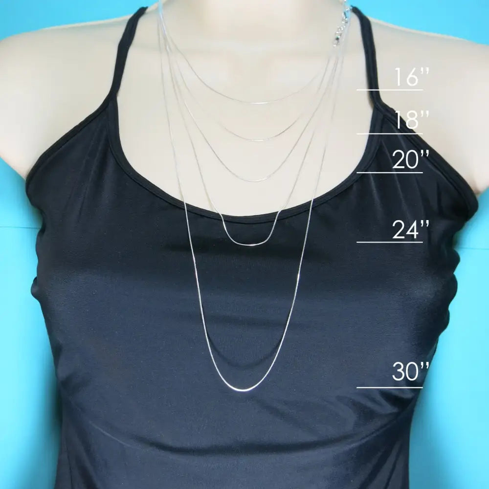 Black tank top showcasing sterling silver snake chain necklace length measurements