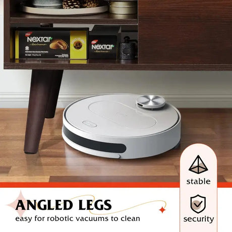 Round robotic vacuum on Stylish Aravis Lift Coffee Table with hidden storage feature