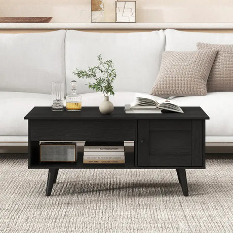 Black mid-century modern coffee table with hidden storage compartment and open shelf