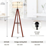 Wooden tripod floor lamp with cream drum shade and built-in circular shelf